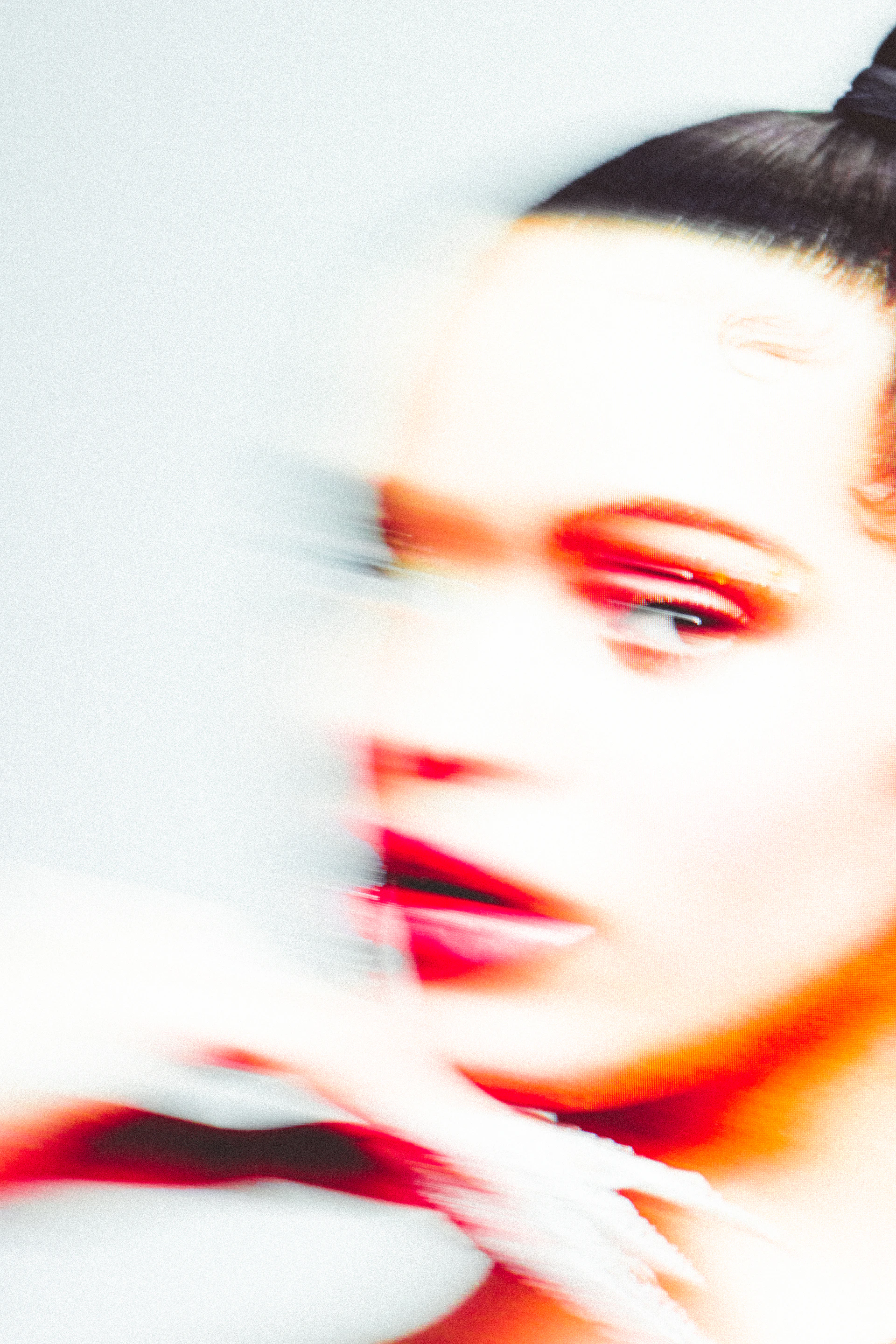 a woman with red lipstick and a black top