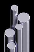 Stainless steel flat bars lined up, reflecting light in the factory environment.