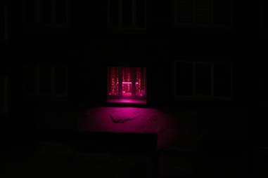 Bright room with pastel pink curtains hanging elegantly, softly lit by natural light.