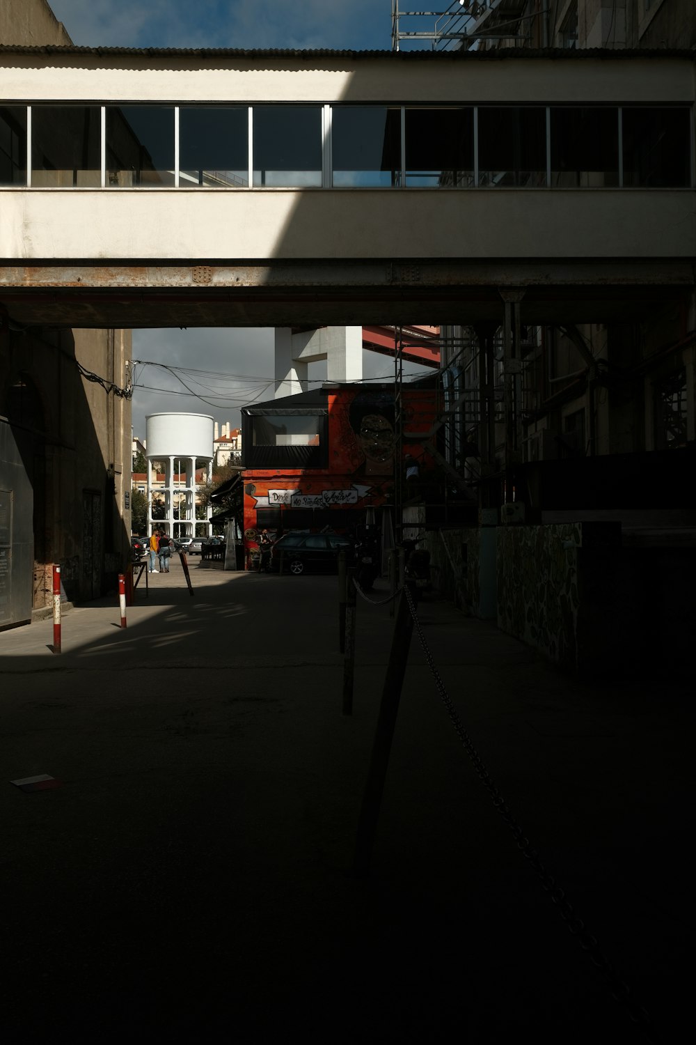 a view of a street under a bridge