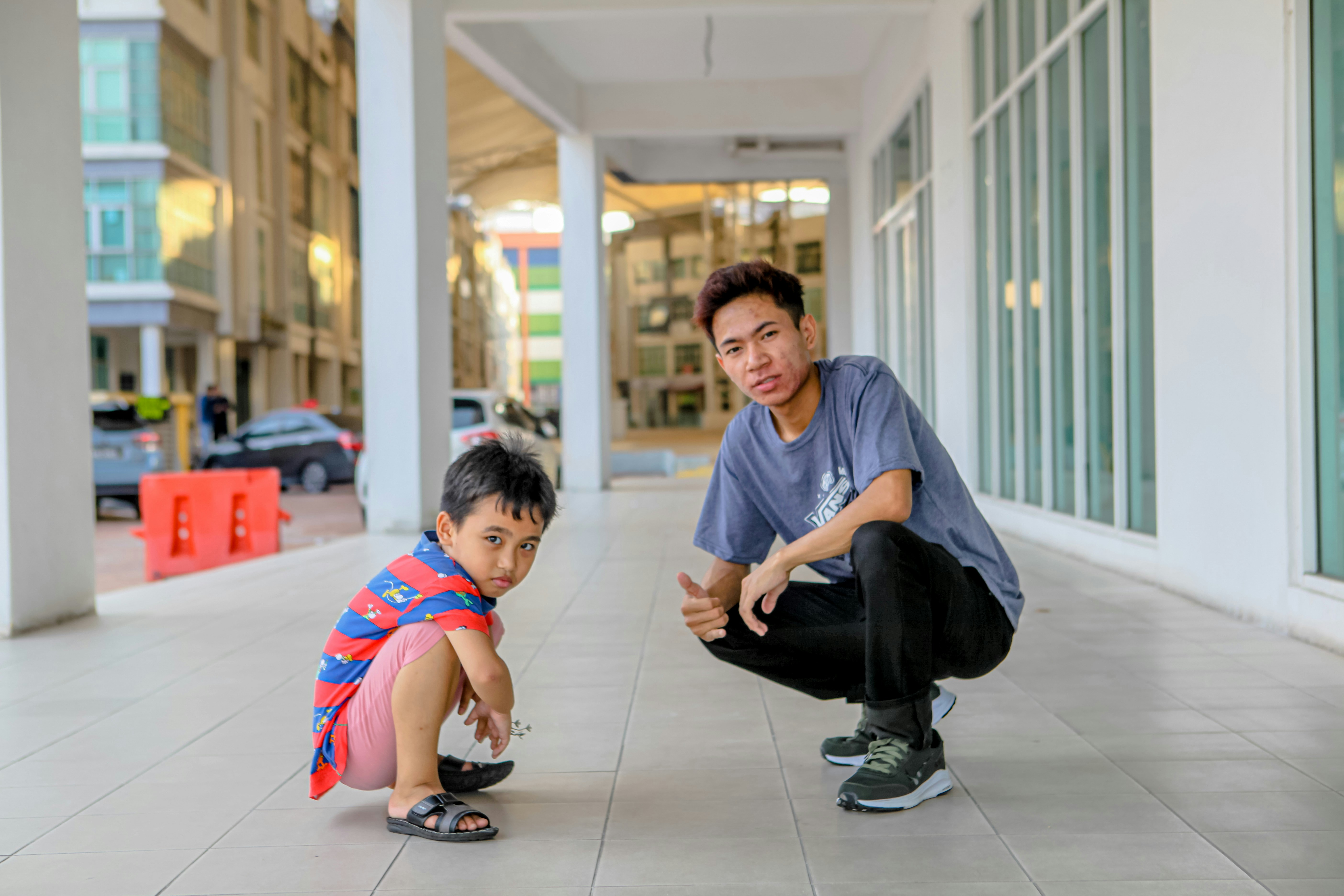 Parent kneeling to make eye contact with a young child