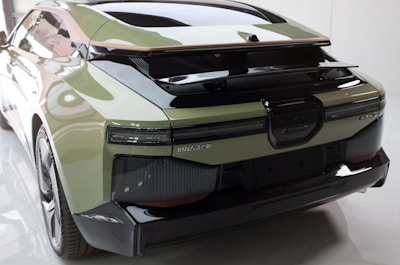 A futuristic eco-city car concept, showcasing sleek lines and green technology.