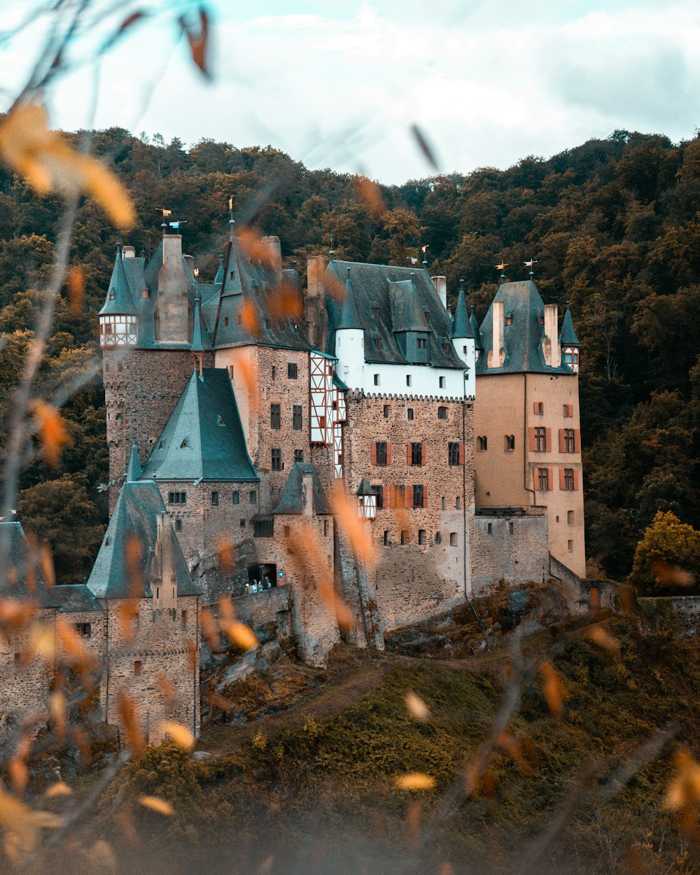 a large castle with a clock on the top of it