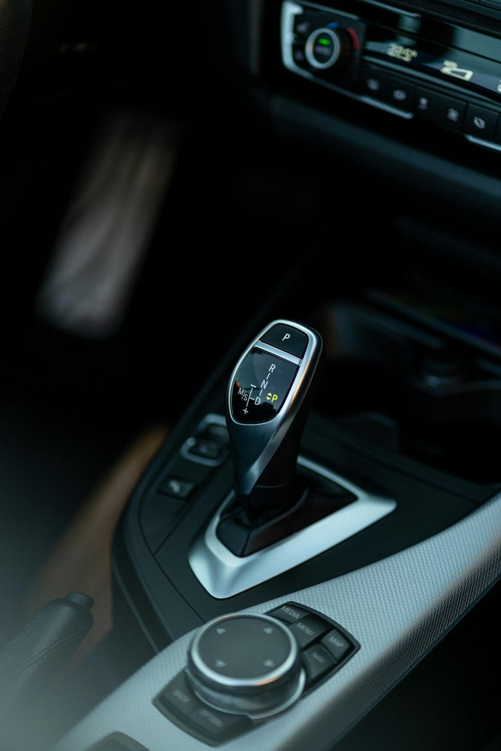 a close up of a car's dashboard with a remote control