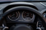 the dashboard of a car with a speedometer and gauges