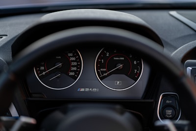 the dashboard of a car with a speedometer and gauges