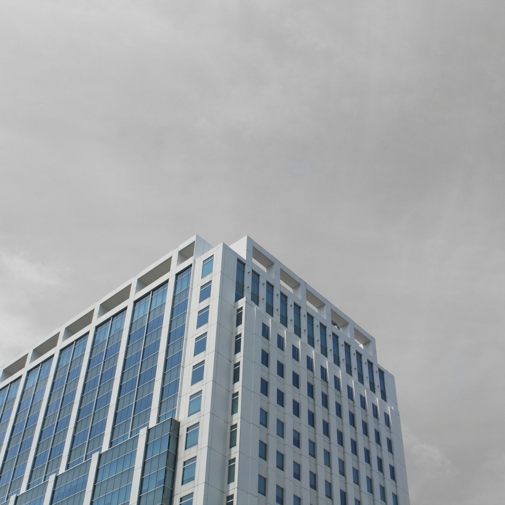 a very tall building with a clock on it's side