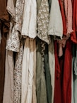 A collection of elegant fancy dresses in various colors.