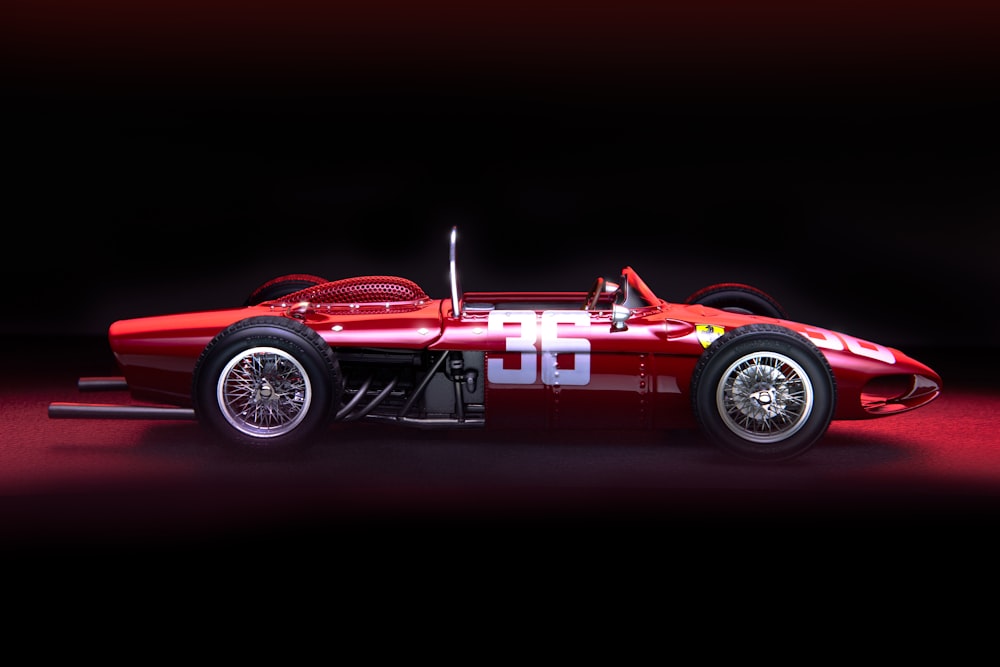 a red race car on a black background