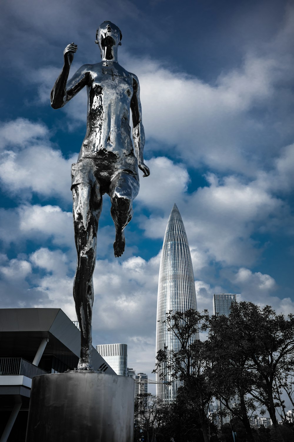 a statue of a man is in front of a building