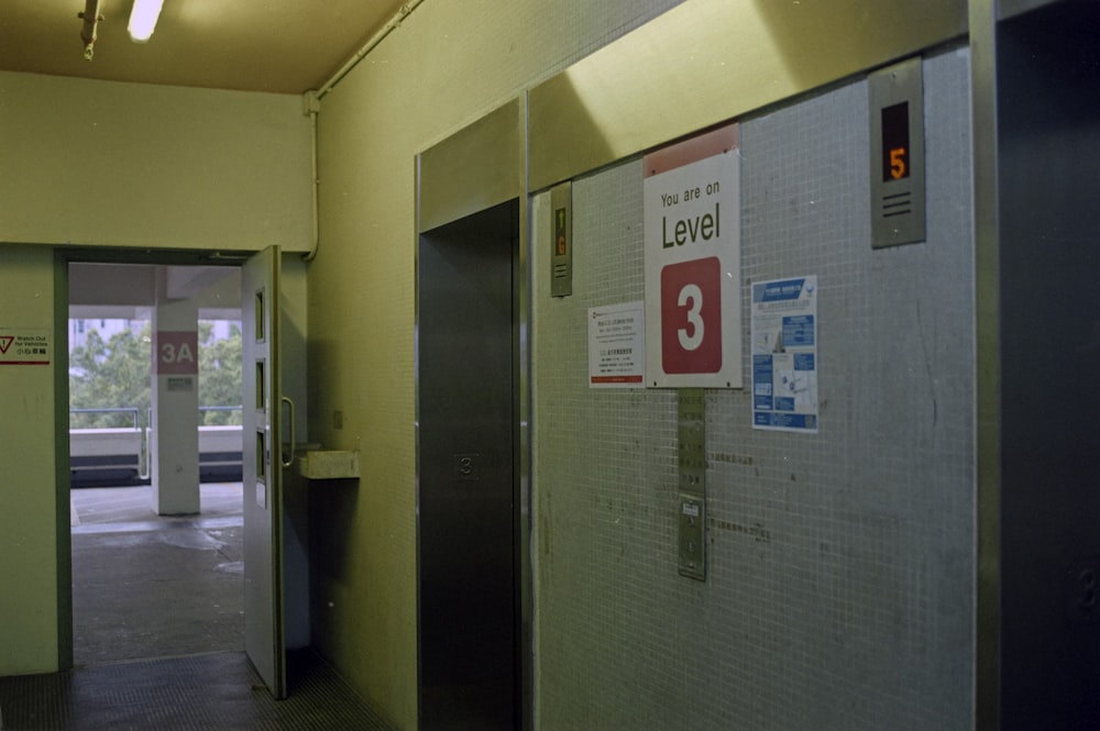 a hallway with a sign and a door