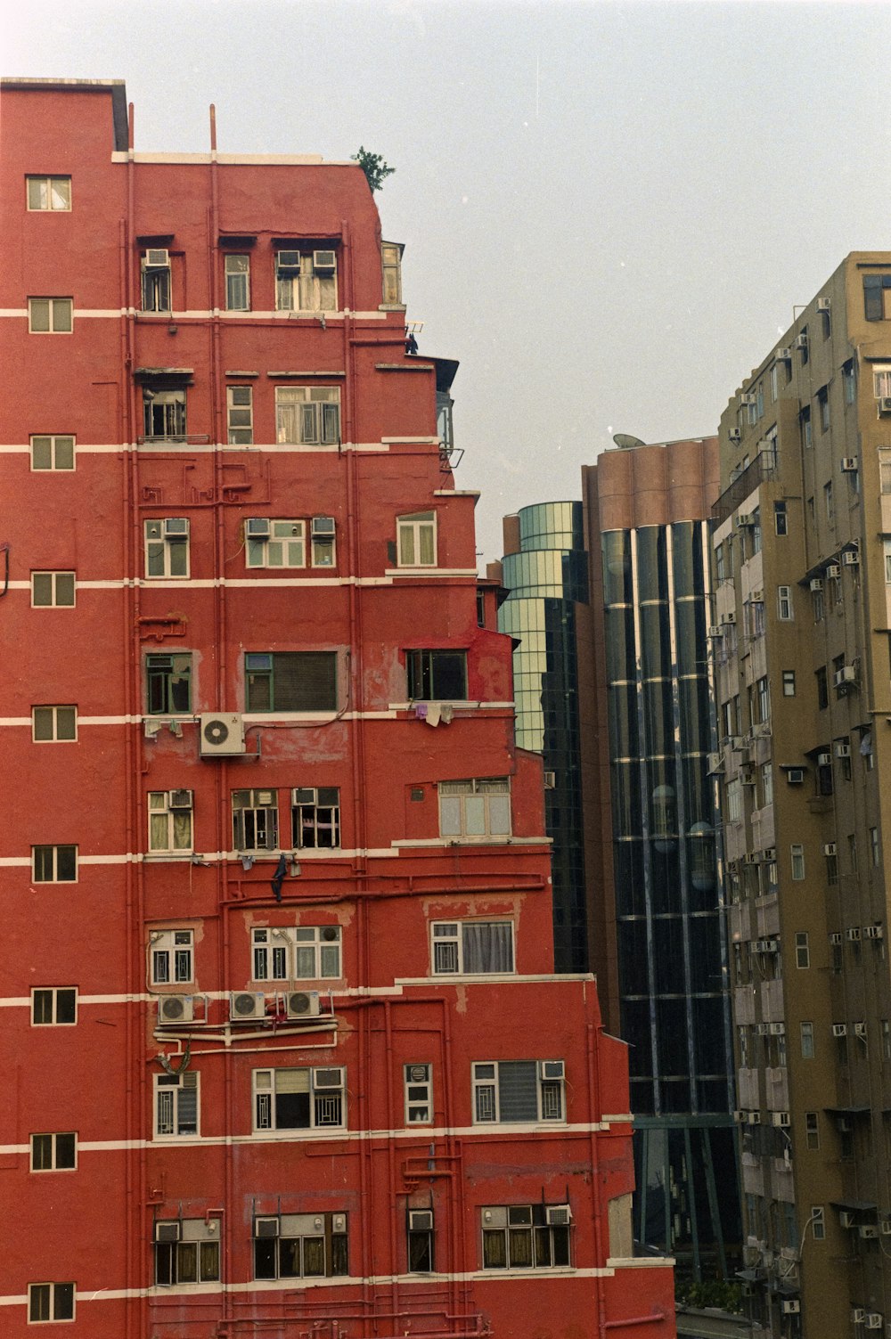 a tall red building with lots of windows