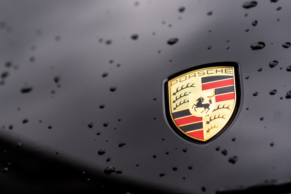 a close up of a porsche emblem on a car