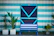 Close-up of a modern door installation with sharp lines and blue accents on black background.