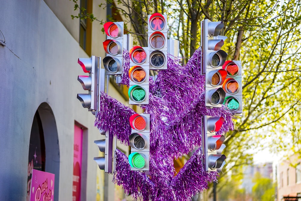 a bunch of traffic lights that are on a pole