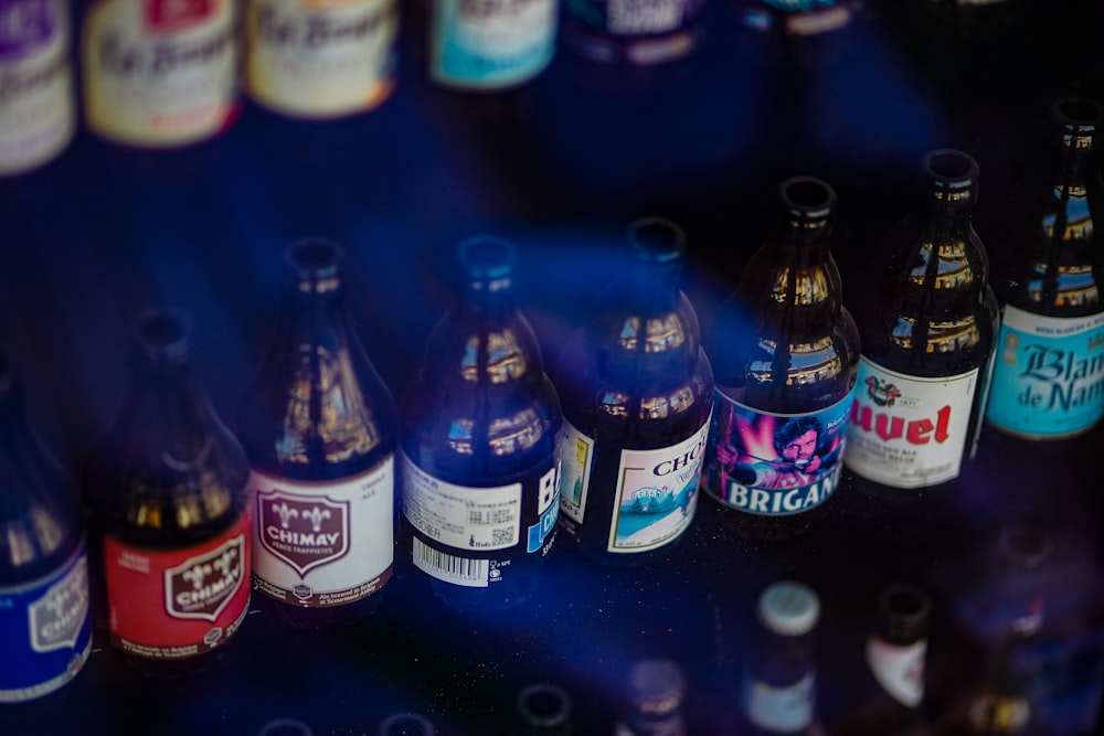 a bunch of bottles that are sitting on a shelf