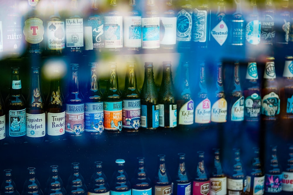 a bunch of bottles of beer on a shelf