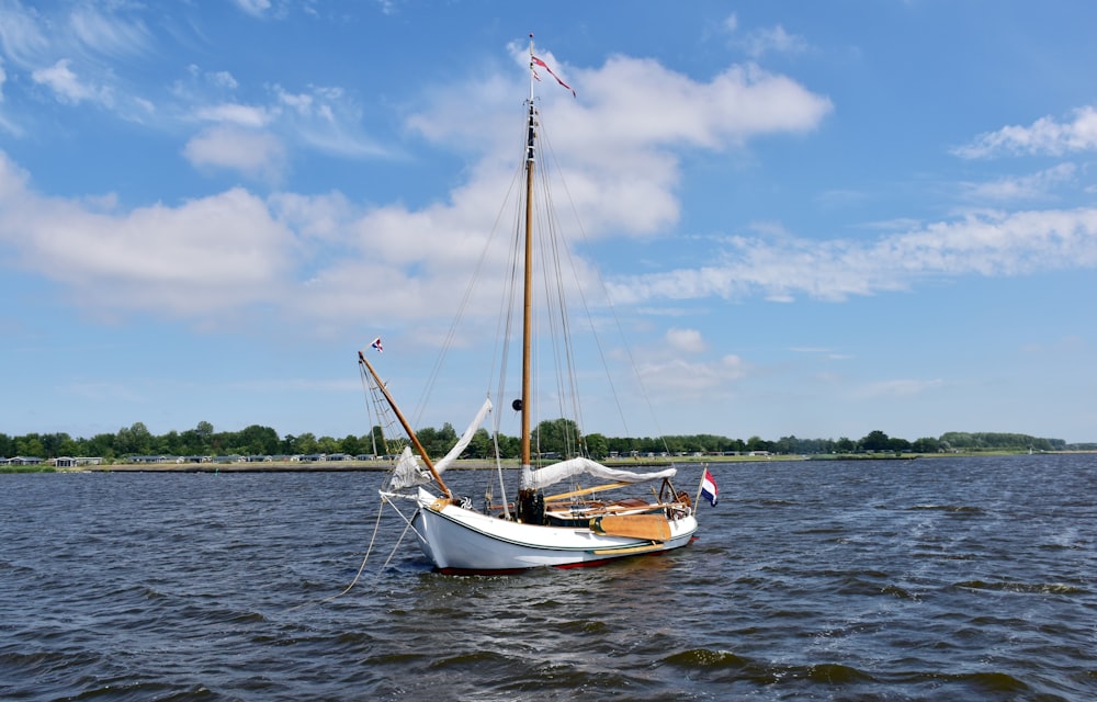 a sailboat floating on top of a body of water