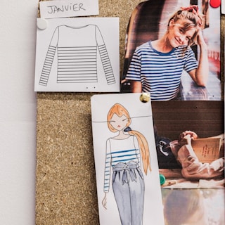 Close-up of rough sketches pinned to a board, showing the evolving ideas that shape elier’s identity.