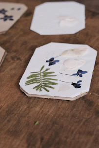 A set of wooden coasters with unique textures, arranged on a rustic table