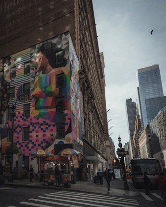 A vibrant street scene in a Black American city featuring local food vendors and cultural murals.