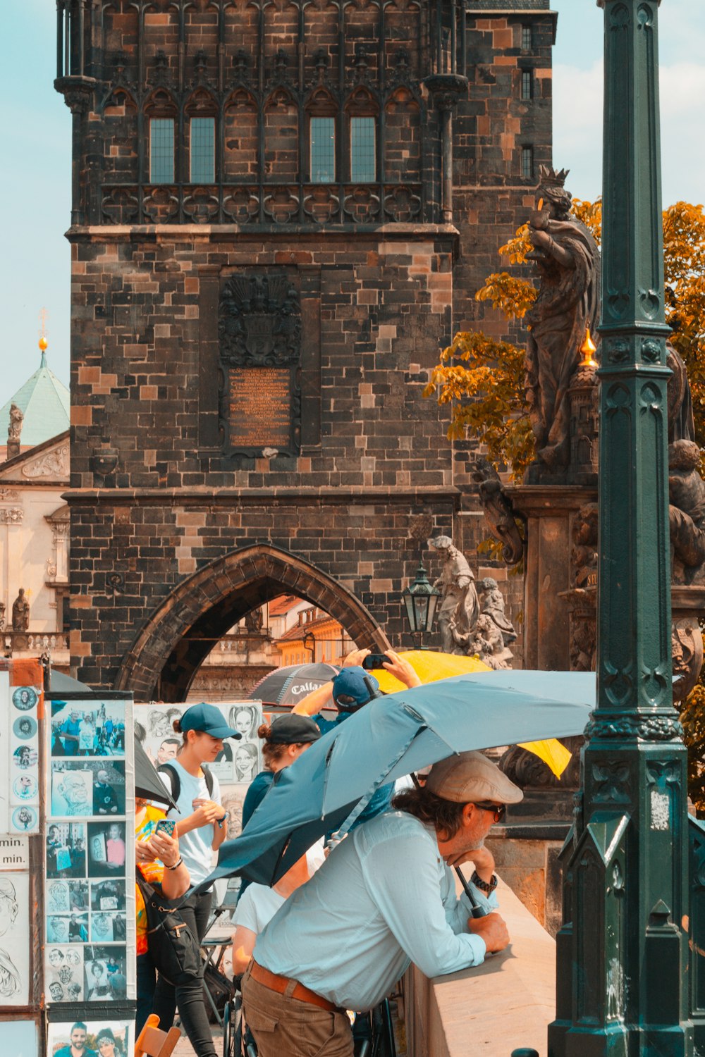 a man with an umbrella on a street corner