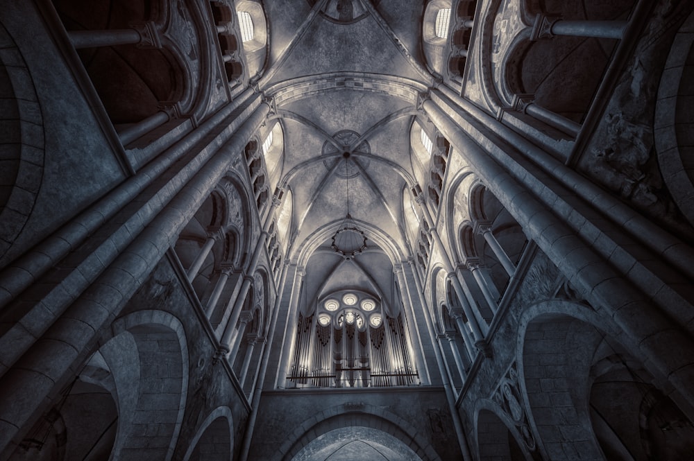 the ceiling of a large cathedral with many windows