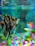 A vibrant tropical fish with black and white stripes swims in a colorful aquarium. The background is a mix of various shades of blue and green, while the bottom of the tank is decorated with multicolored pebbles. A few brightly colored objects, possibly aquarium decorations, are visible out of focus in the background.