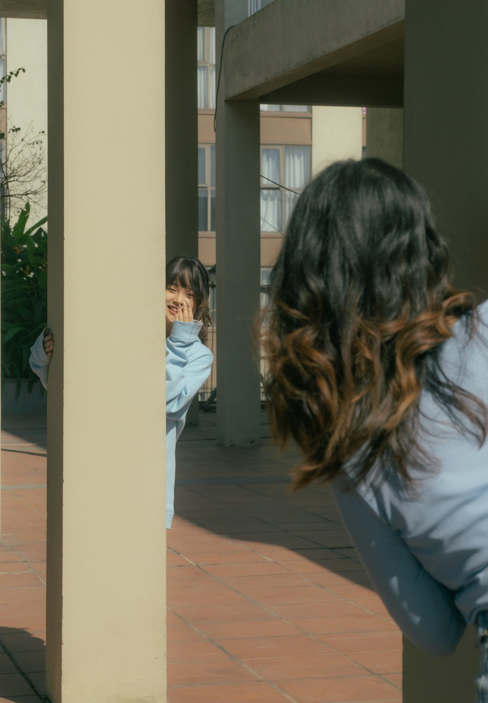 a woman taking a picture of herself in a mirror