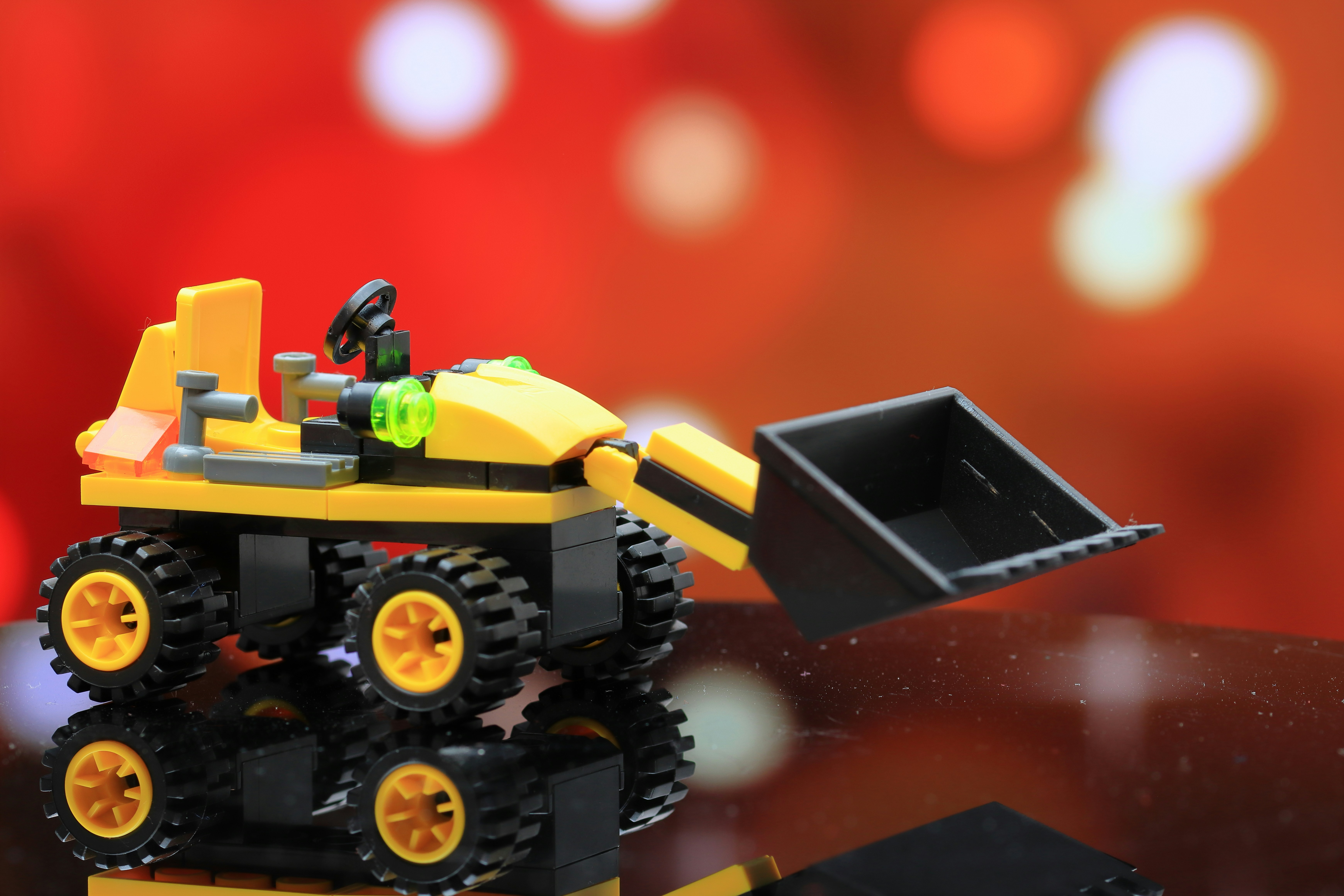 a lego construction vehicle with a shovel on top of it