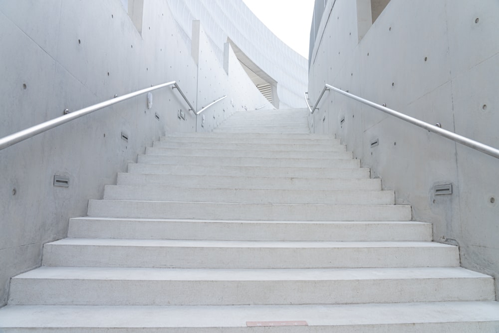 a set of white stairs leading up to a building
