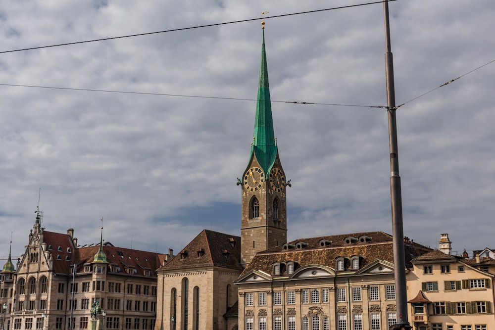 a large building with a green steeple on top of it