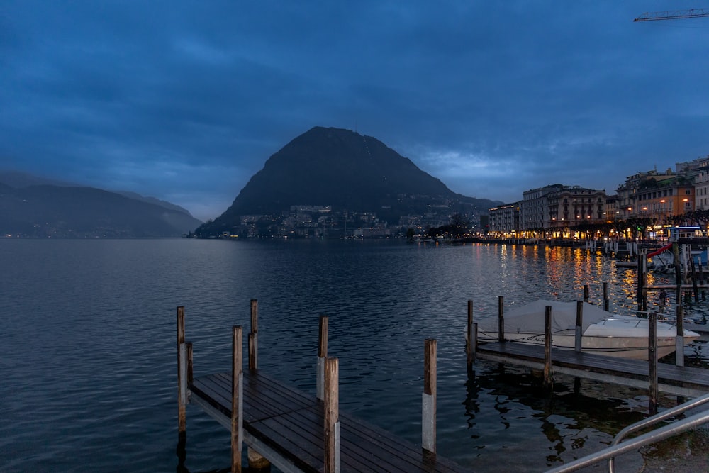 a dock with a mountain in the background