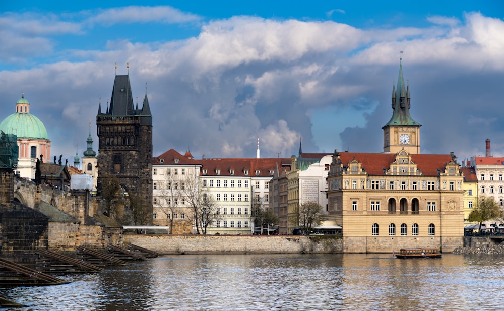 a large body of water with buildings in the background