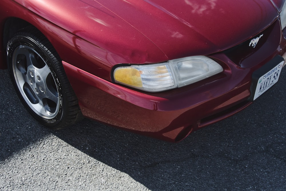 a red car parked in a parking lot