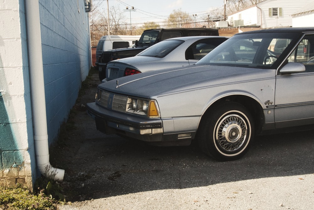 a car parked in a parking lot next to a building