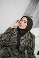A model showcasing a trendy hijab ensemble.