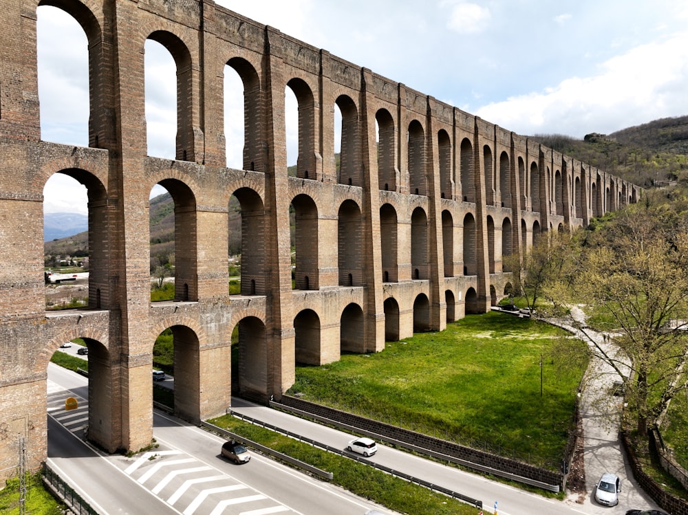 a large brick structure with arches on the side of it