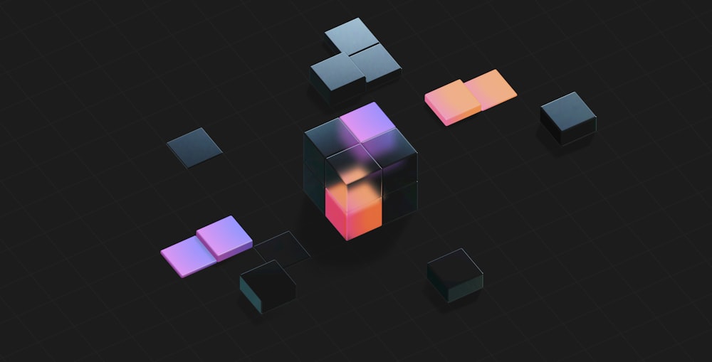 a group of cubes that are on a black surface