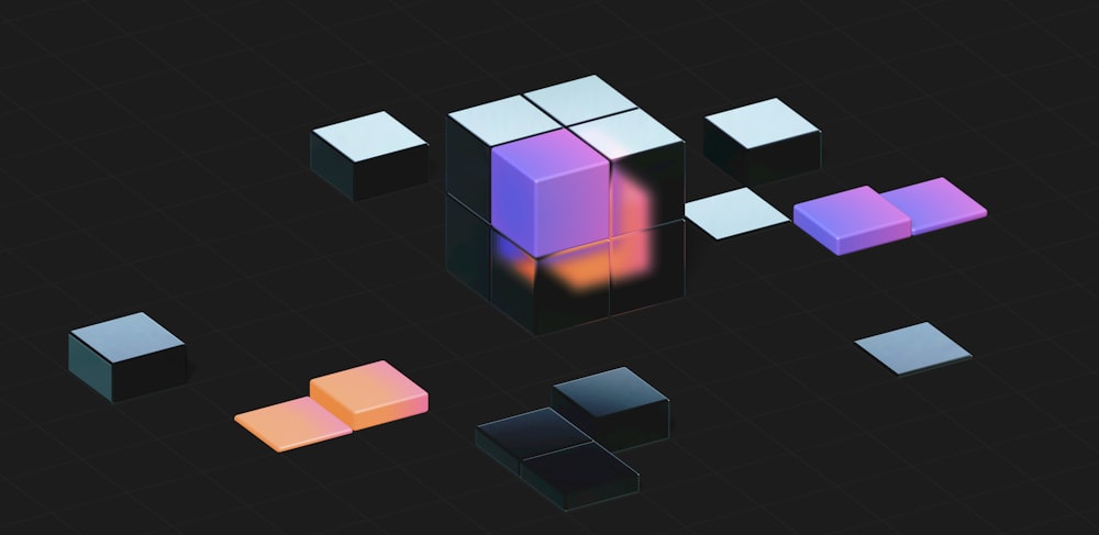 a group of cubes that are on a black surface