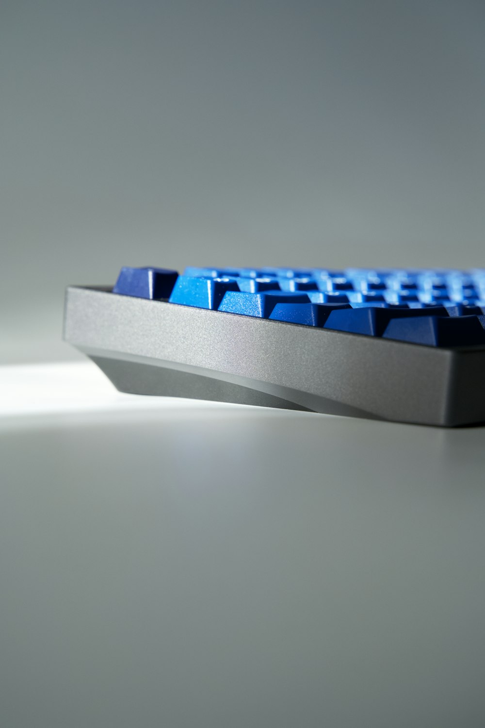 a computer keyboard sitting on top of a table