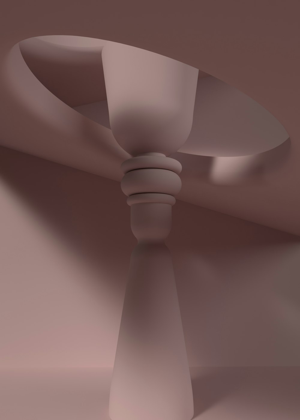 a white ceiling fan in a room with a brown wall
