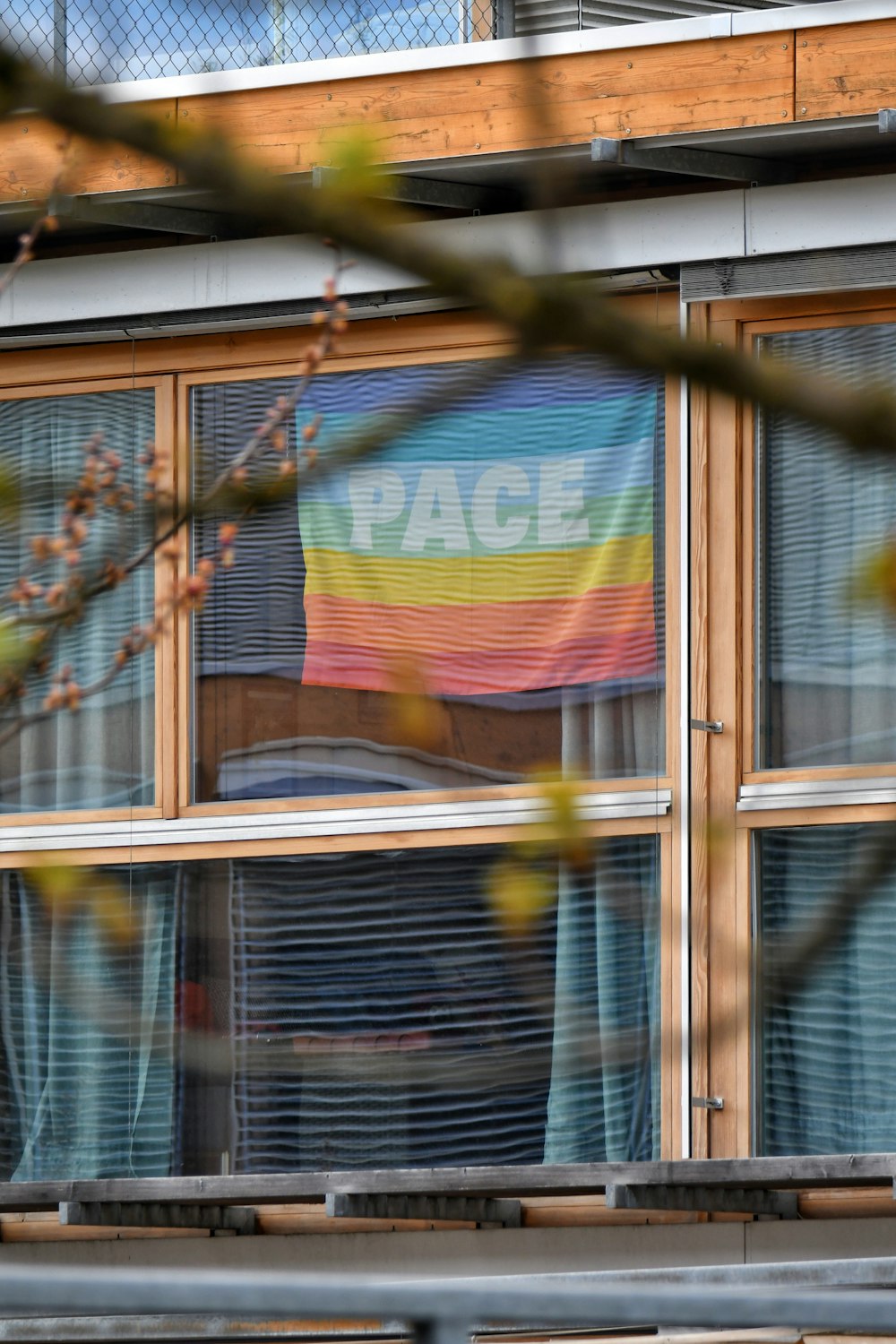 a building with a flag hanging out of it's windows