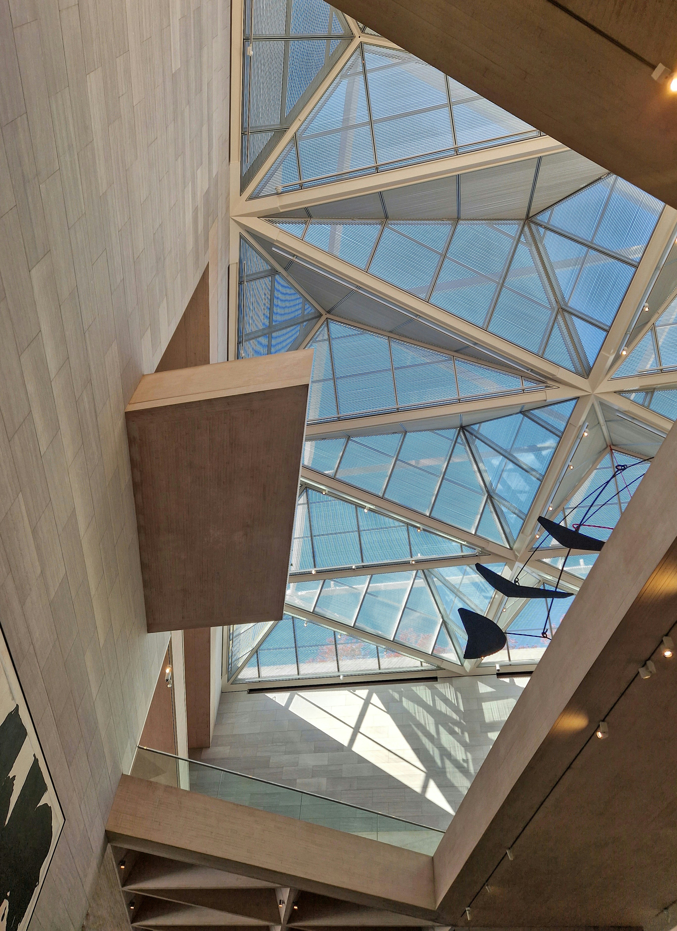 the ceiling of a building with a glass roof