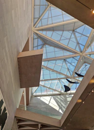the ceiling of a building with a glass roof