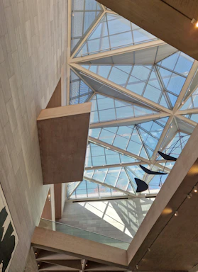 the ceiling of a building with a glass roof