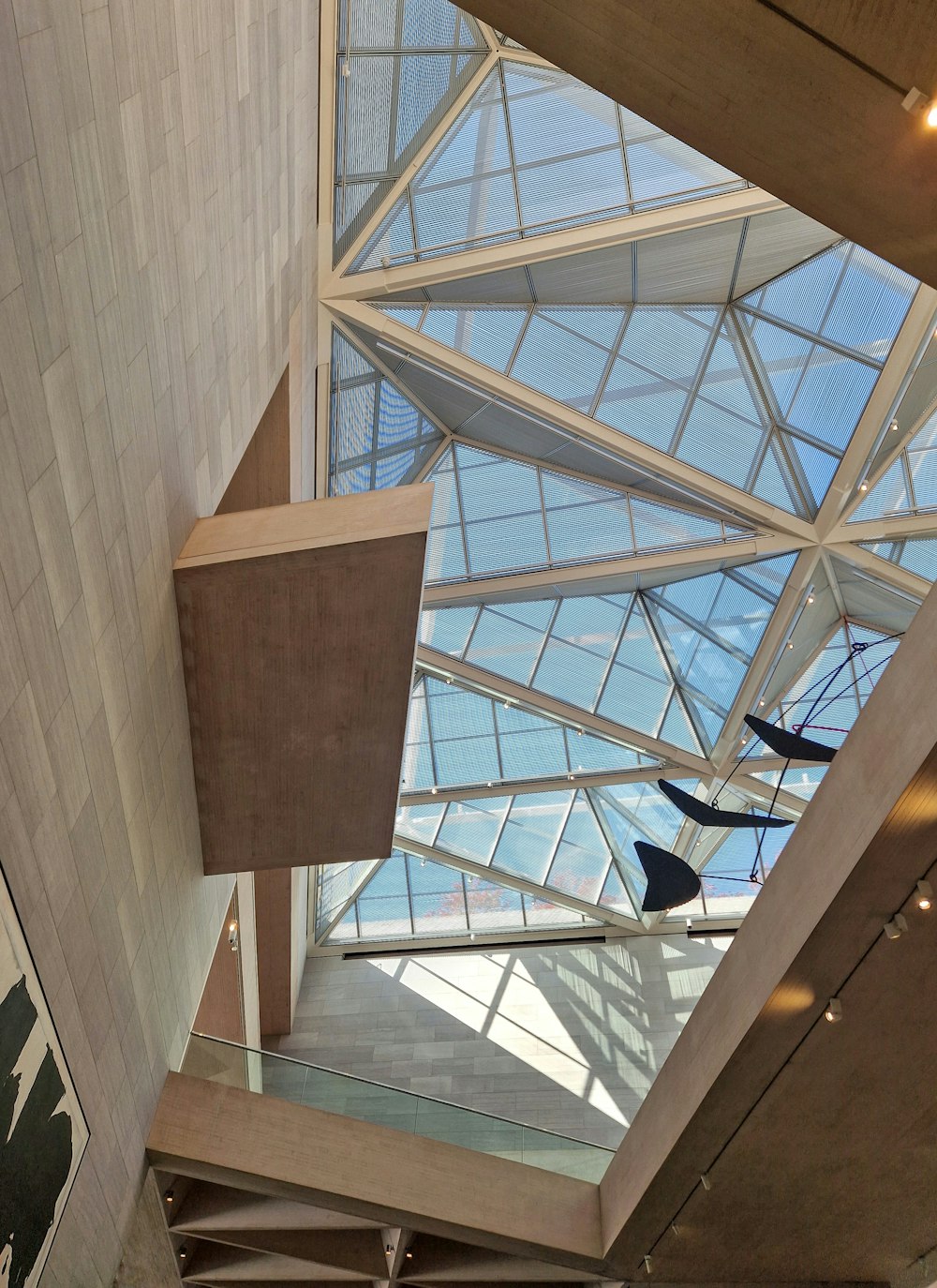 the ceiling of a building with a glass roof