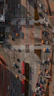an aerial view of an intersection with cars and trucks