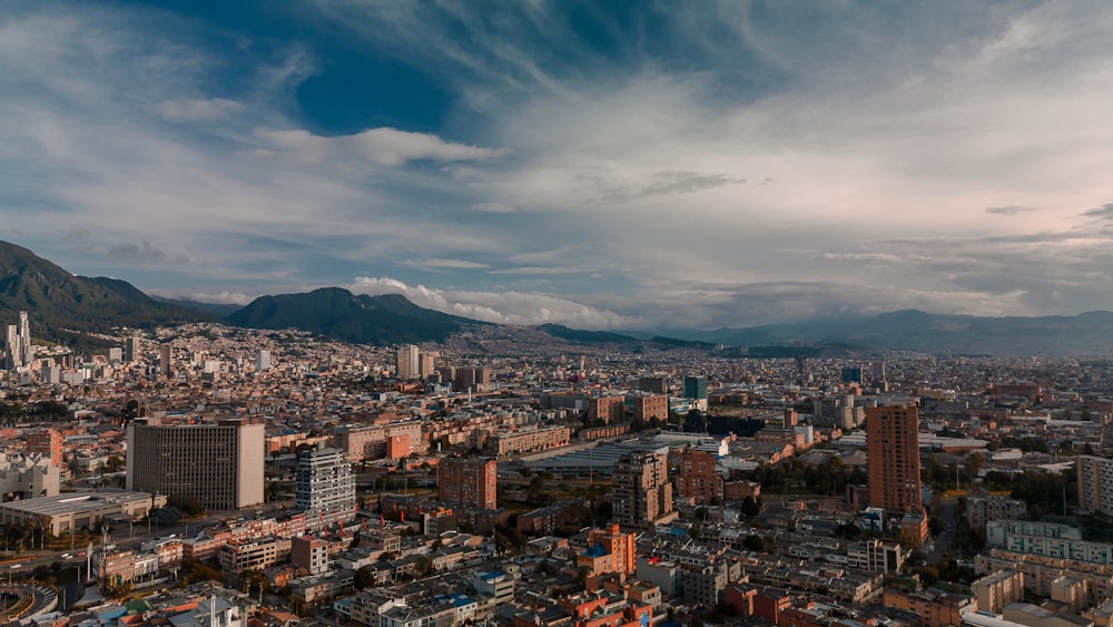 a view of a city with mountains in the background