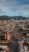 an aerial view of a city with mountains in the background